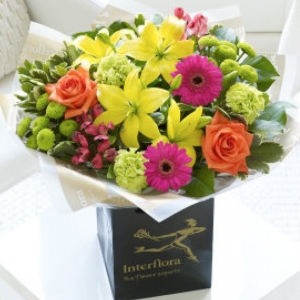 aA vibrant selection of roses, lily, germini, caranations, chrysanths and alstromaria.