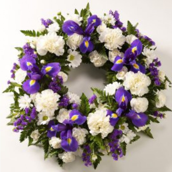 Classic carnations, chrysanths and iris in purple and white