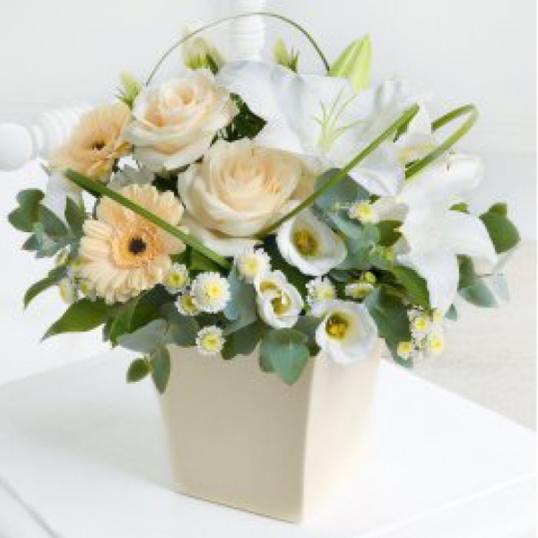 Featuring germini, roses, lily, lisianthus and crysanths. An elegant combination.